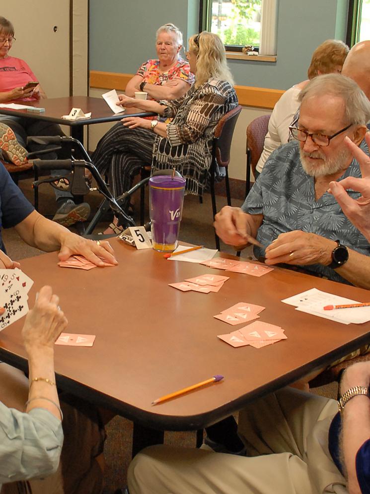 Members playing the card game 500