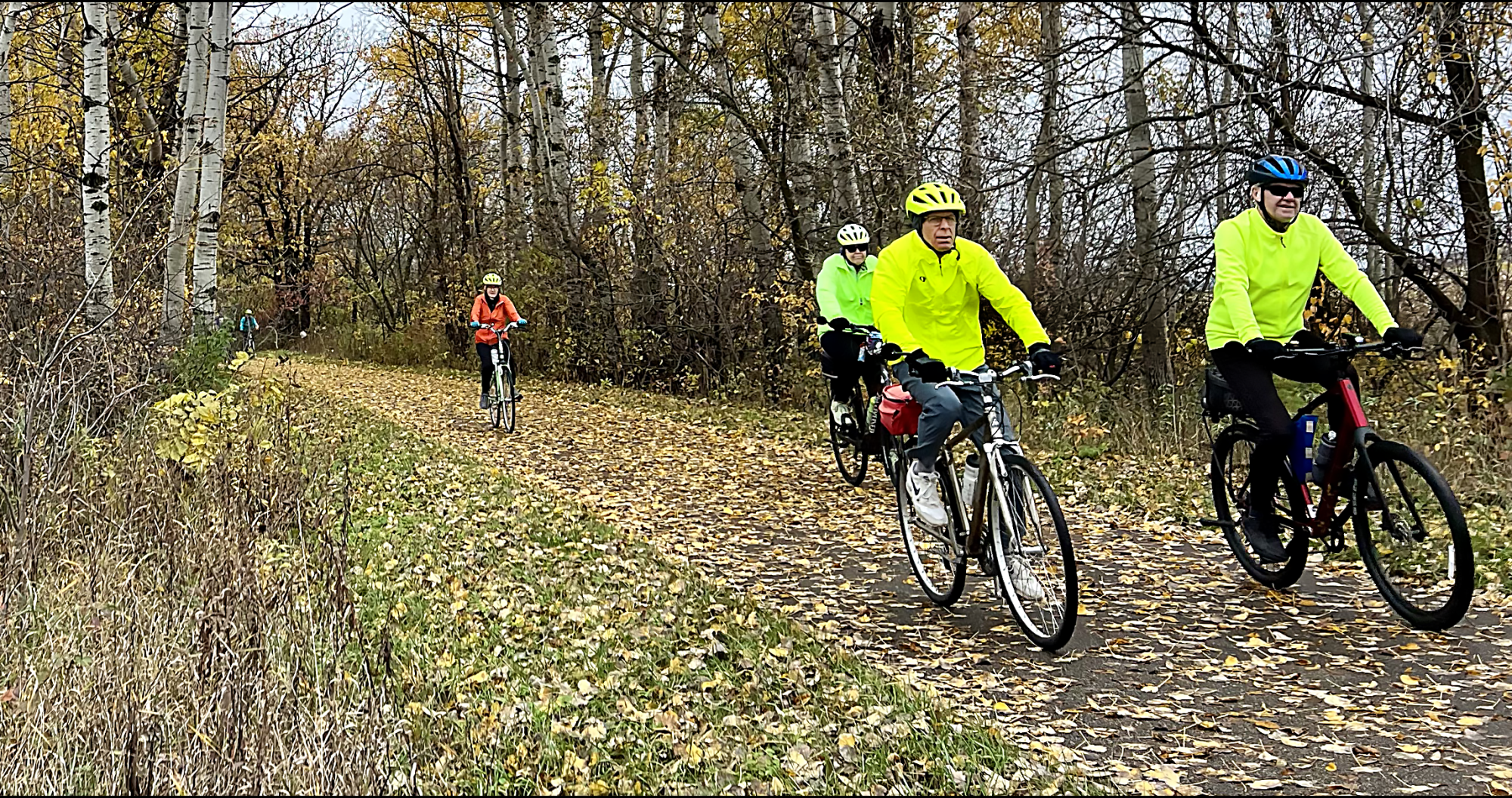 Bikers on a trail in fall